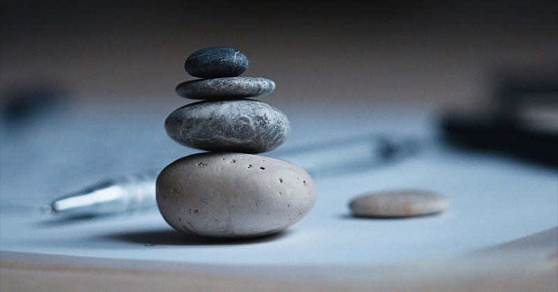 Stones balanced on a desk