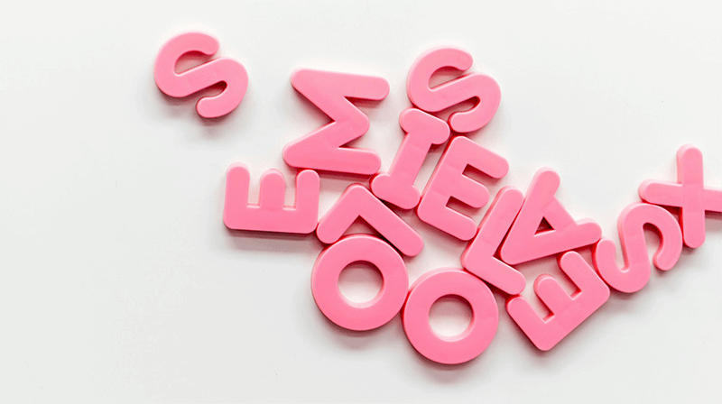 Scattered pink letters